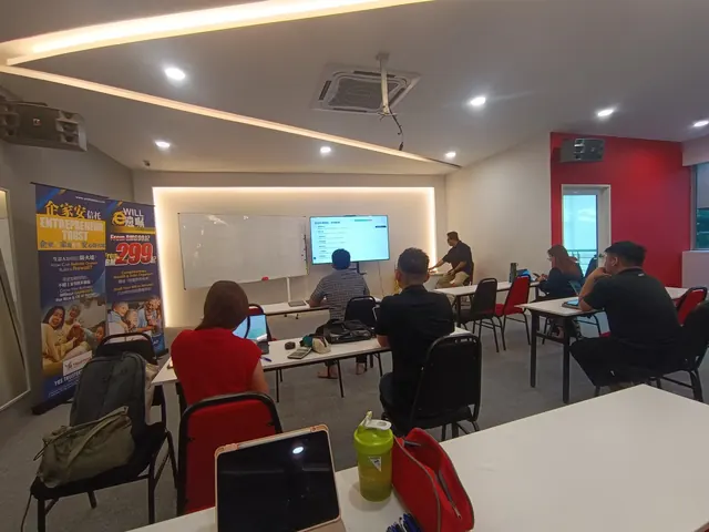 Participants working at their desks during a training session