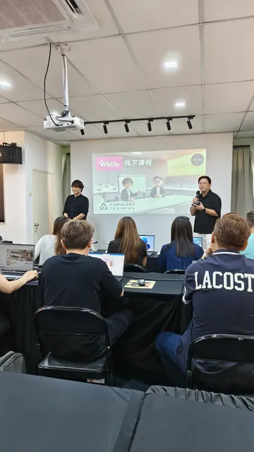Participants working on their own laptops during a hands-on session
